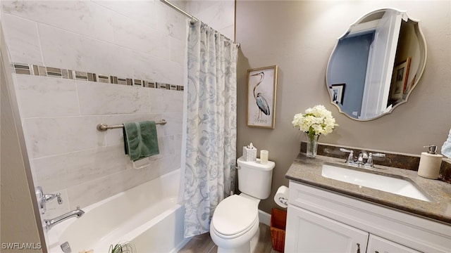 full bathroom featuring vanity, shower / tub combo, and toilet