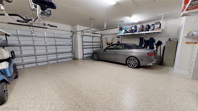 garage featuring a garage door opener