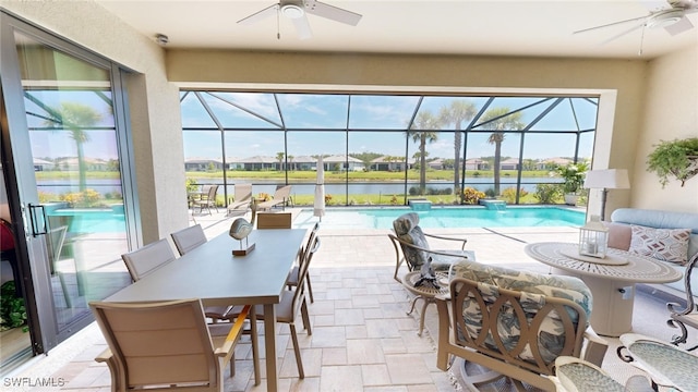 view of pool featuring a water view and ceiling fan