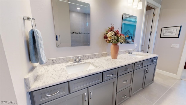 bathroom featuring tile patterned flooring and vanity