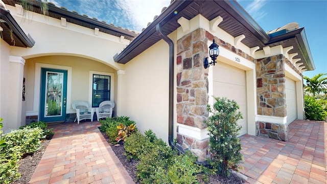 doorway to property featuring a garage