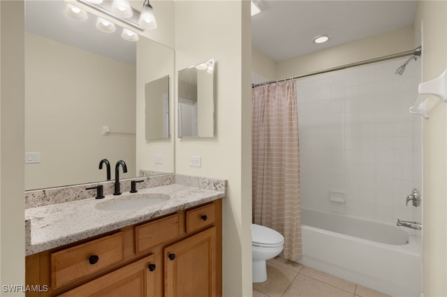 bathroom featuring tile patterned flooring, vanity, toilet, and shower / bath combo with shower curtain