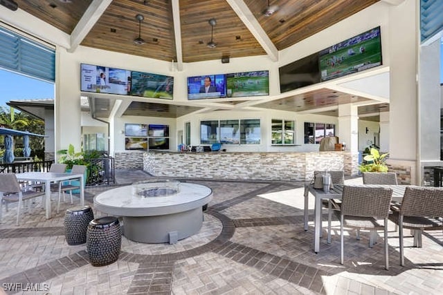 view of patio with an outdoor fire pit and outdoor dining area