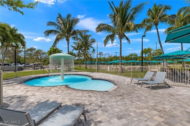 view of swimming pool with a fenced in pool, fence, and a patio