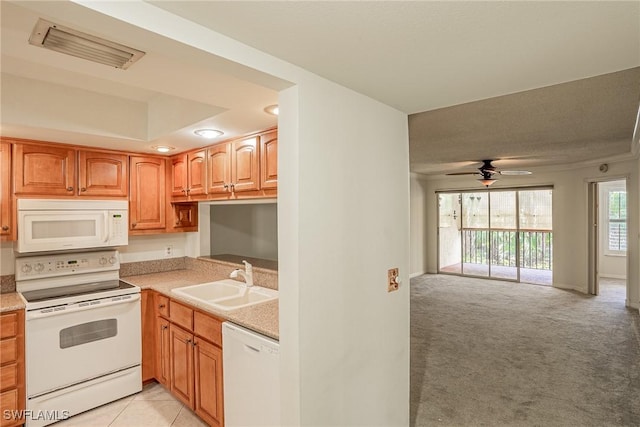 kitchen featuring light carpet, sink, ceiling fan, and white appliances