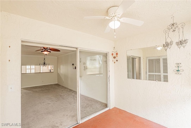 interior space featuring ceiling fan and carpet floors