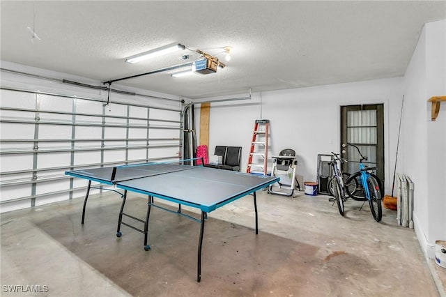 playroom with concrete floors and a textured ceiling