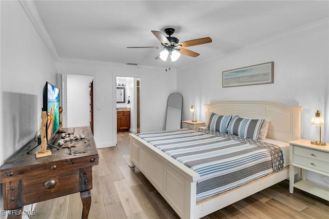 bedroom with connected bathroom, light hardwood / wood-style floors, ceiling fan, and ornamental molding