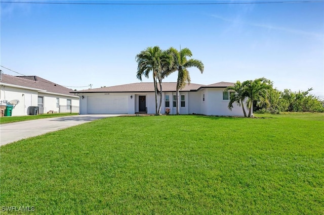 single story home featuring a front lawn and a garage