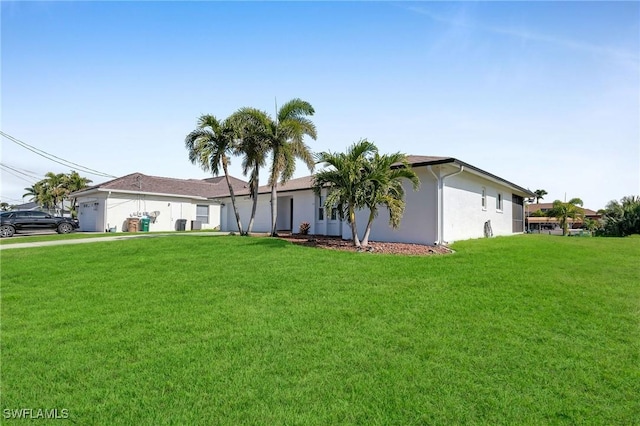 ranch-style home featuring a garage and a front lawn