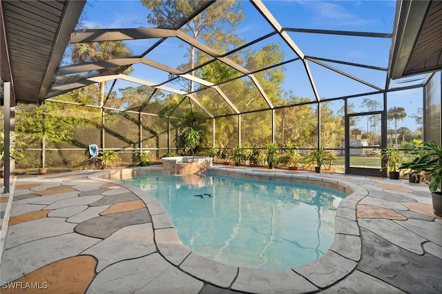 view of swimming pool with a lanai and a patio