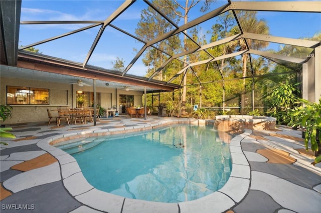 view of swimming pool featuring ceiling fan, a patio, and glass enclosure