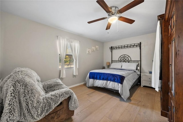 bedroom featuring light hardwood / wood-style floors and ceiling fan