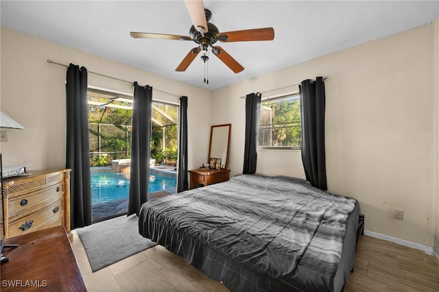 bedroom with ceiling fan, access to exterior, and wood-type flooring