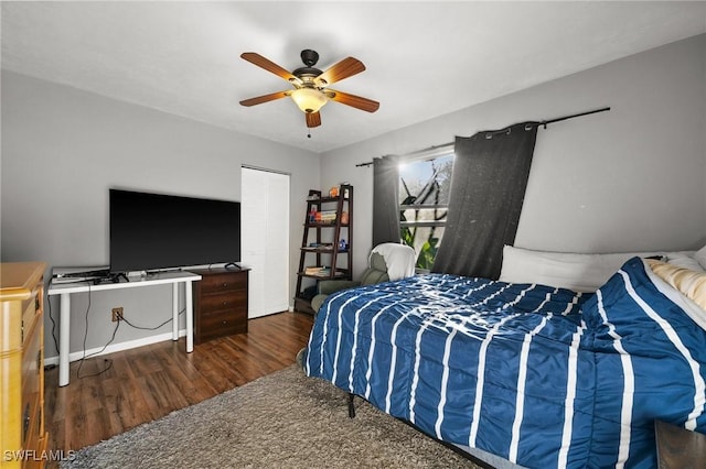 bedroom featuring dark hardwood / wood-style floors and ceiling fan