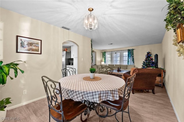 dining room featuring a chandelier