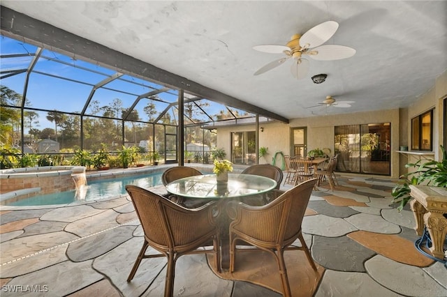 sunroom featuring ceiling fan and a swimming pool