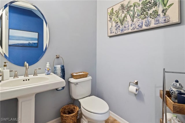 bathroom featuring toilet