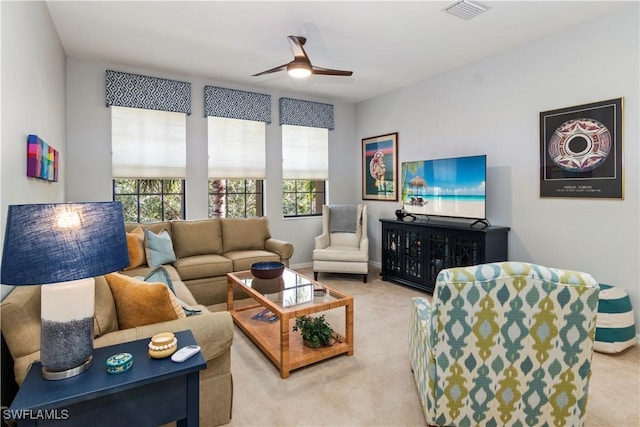 living room featuring carpet flooring and ceiling fan