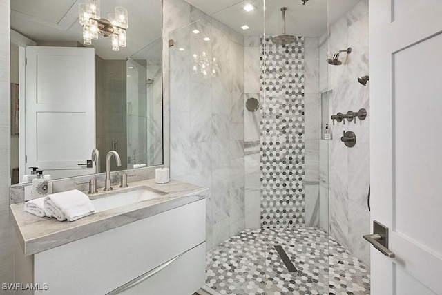 bathroom featuring vanity and a shower with shower door