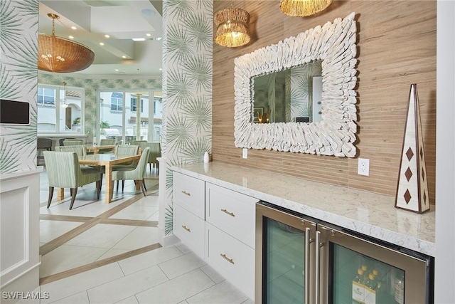 231 Colonade Cir, Naples, FL 34103 - bar area featuring wine cooler, light tile patterned floors, recessed lighting, and hanging light fixtures