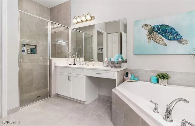 bathroom featuring tile patterned floors, vanity, and separate shower and tub