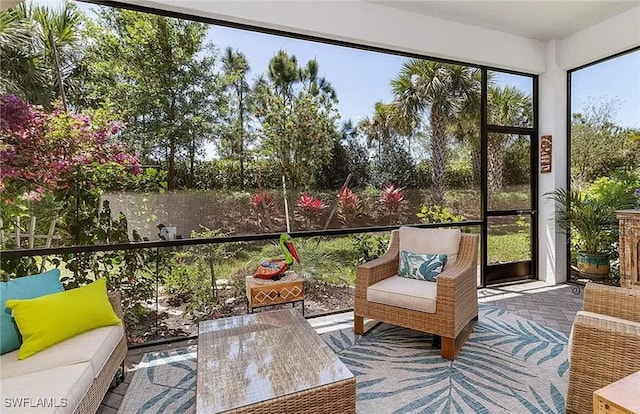 sunroom / solarium featuring a healthy amount of sunlight