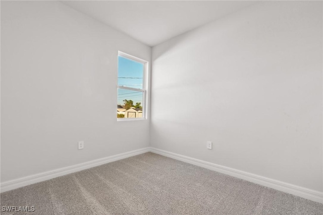 spare room featuring carpet flooring