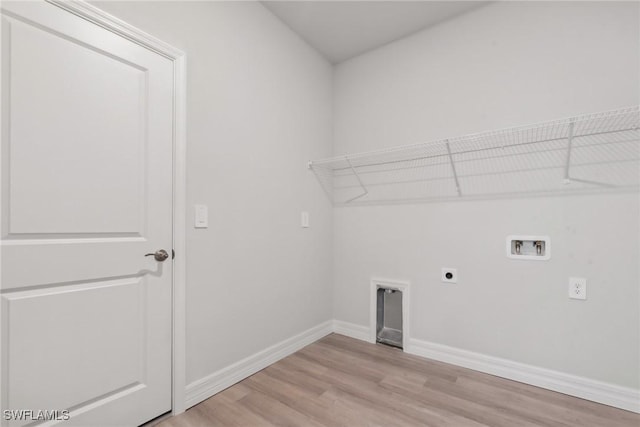 laundry room with hookup for an electric dryer, light wood-type flooring, and washer hookup