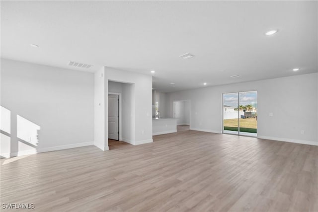 unfurnished living room featuring light hardwood / wood-style flooring