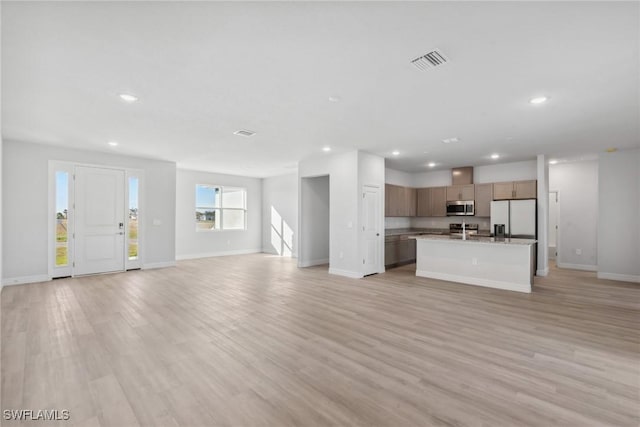 unfurnished living room with light hardwood / wood-style floors