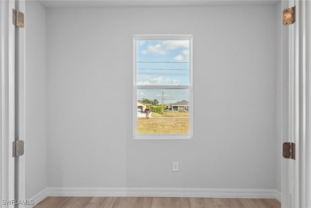 spare room featuring light wood-type flooring