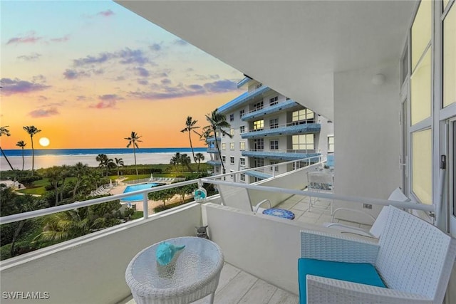 balcony at dusk with a water view