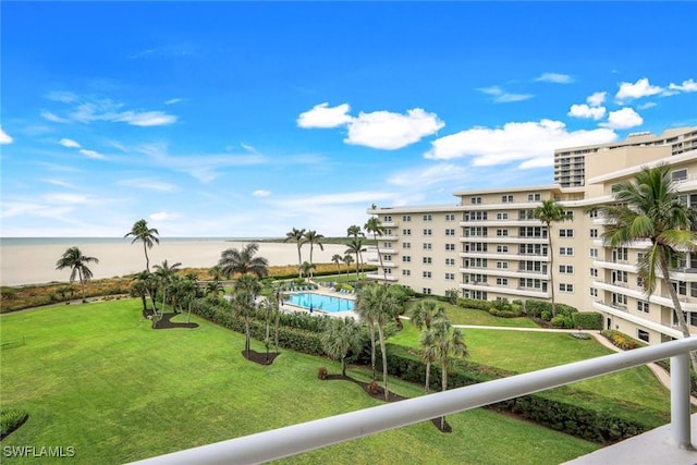 view of swimming pool featuring a water view