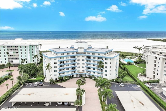 aerial view featuring a view of the beach and a water view