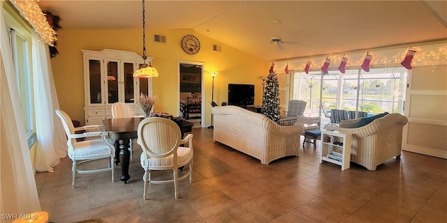 living room featuring vaulted ceiling