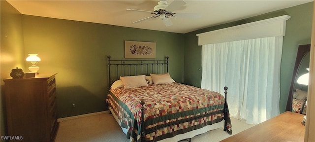 bedroom with light colored carpet and ceiling fan