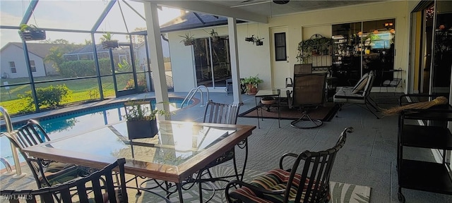 view of patio with a lanai and ceiling fan