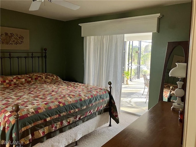 carpeted bedroom featuring access to outside and ceiling fan