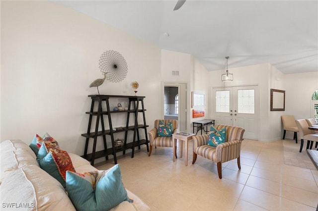 living room with light tile patterned floors and french doors