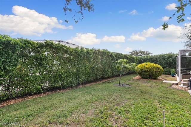 view of yard featuring a lanai