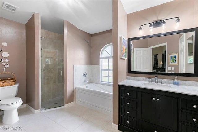 full bathroom with plus walk in shower, tile patterned flooring, vanity, and toilet