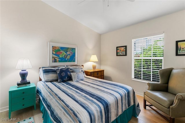 bedroom featuring ceiling fan and light hardwood / wood-style flooring