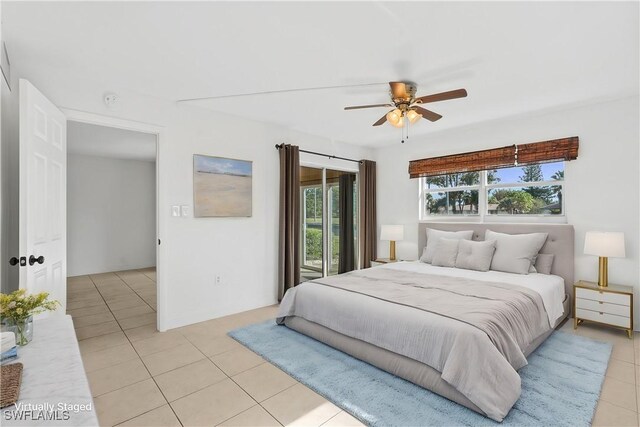 tiled bedroom with ceiling fan