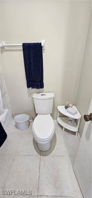 bathroom with tile patterned flooring and toilet