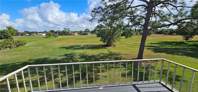 view of yard with a balcony