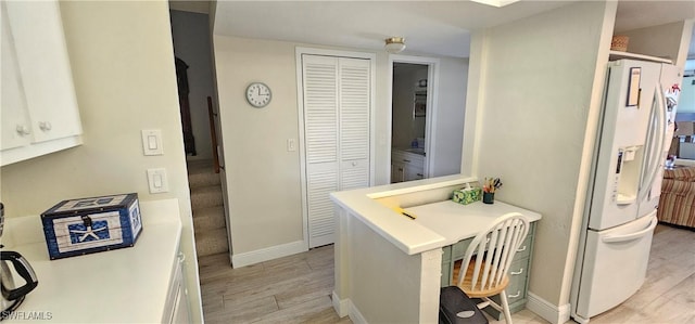 bathroom with hardwood / wood-style floors