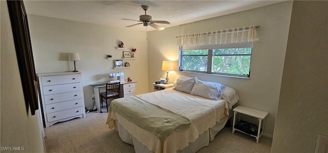 bedroom with ceiling fan and light colored carpet