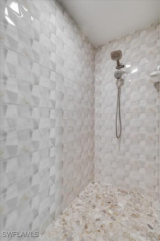 bathroom with a tile shower