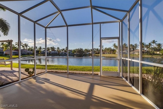 unfurnished sunroom featuring plenty of natural light and a water view